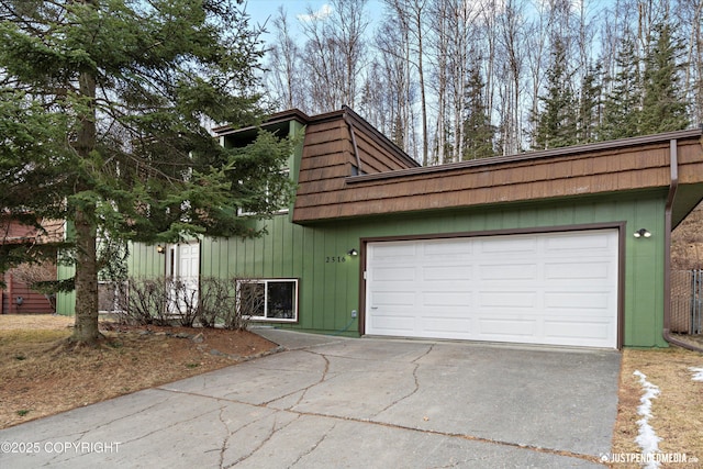 garage with concrete driveway