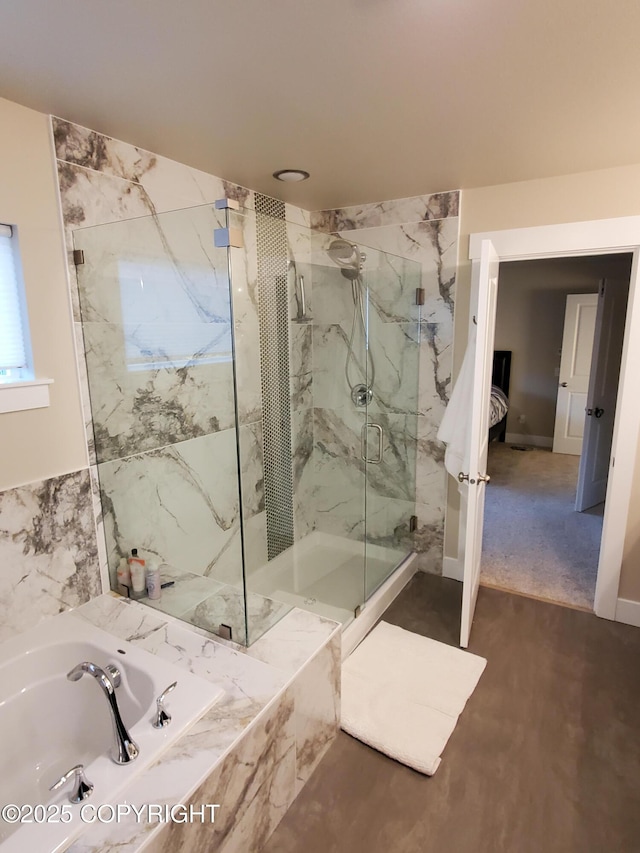 full bathroom with a garden tub and a marble finish shower