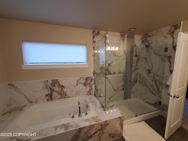 full bathroom featuring a marble finish shower and a bath