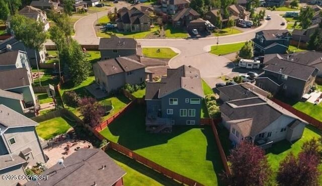 birds eye view of property with a residential view