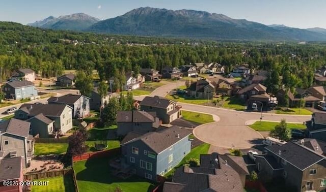 aerial view with a mountain view and a residential view