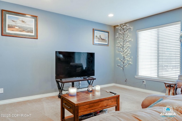 living area with recessed lighting, baseboards, and carpet floors