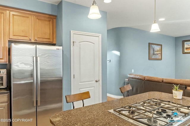 kitchen featuring decorative light fixtures and appliances with stainless steel finishes