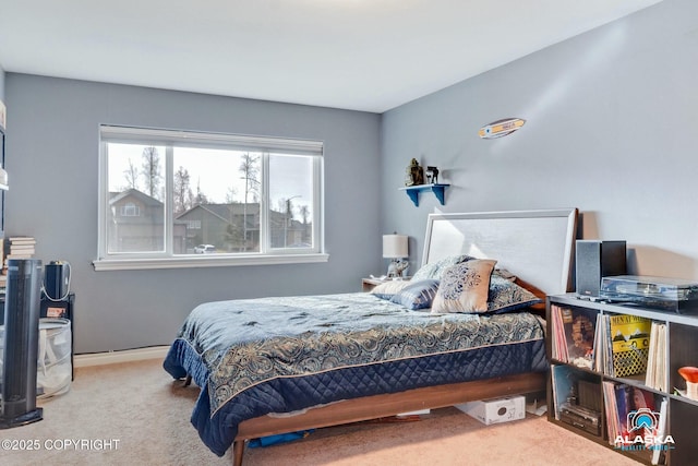 carpeted bedroom with baseboards