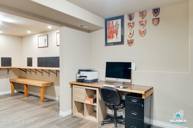 home office with recessed lighting, light wood-style floors, visible vents, and baseboards