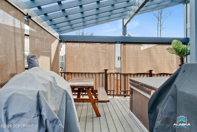 wooden terrace featuring grilling area and a pergola