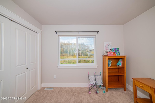 game room featuring light carpet, visible vents, and baseboards