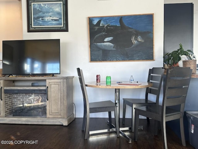 dining area with dark wood-style flooring