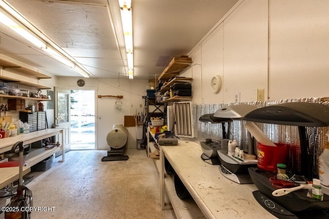 kitchen with white cabinetry, light countertops, and unfinished concrete floors