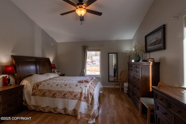 bedroom featuring ceiling fan, baseboards, wood finished floors, and vaulted ceiling