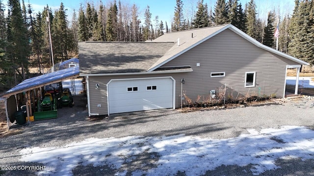 view of side of property with a shingled roof