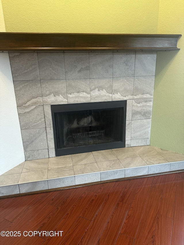 interior details with a tiled fireplace