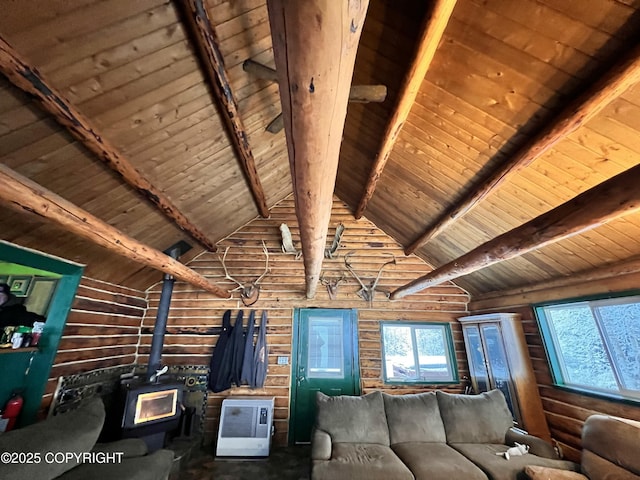 unfurnished living room with high vaulted ceiling, wood ceiling, beamed ceiling, and a wood stove