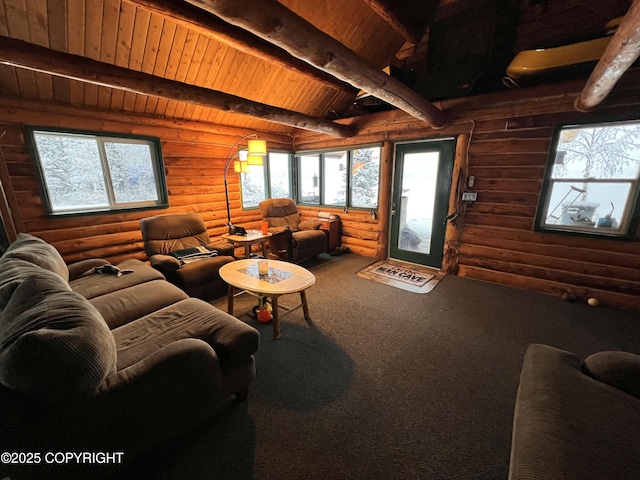 living room with vaulted ceiling with beams, wooden ceiling, rustic walls, and carpet flooring