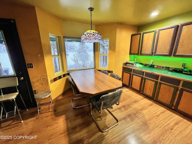 kitchen featuring light wood-style floors, recessed lighting, and decorative light fixtures