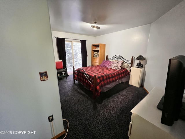 carpeted bedroom featuring access to outside