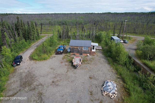 aerial view featuring a wooded view