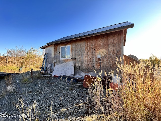 view of property exterior featuring metal roof