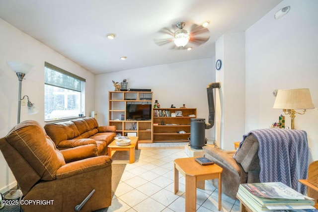 living room with light tile patterned floors and ceiling fan