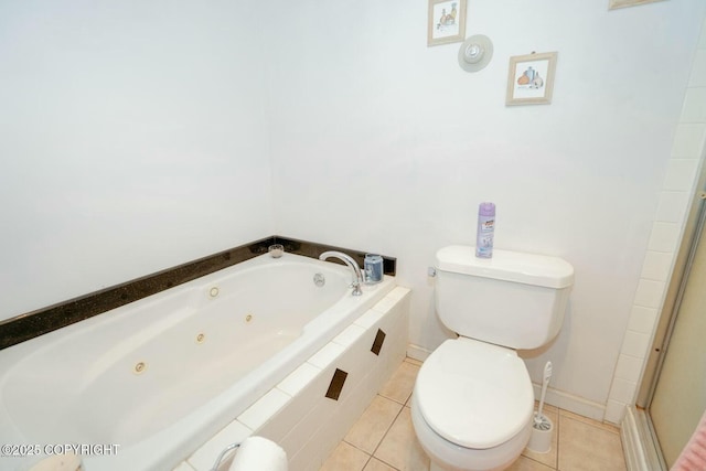 full bath with baseboards, toilet, a shower with door, a jetted tub, and tile patterned flooring