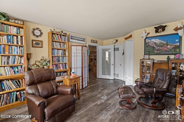 sitting room with visible vents and wood finished floors