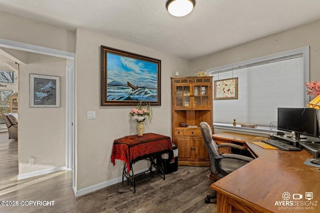 office featuring baseboards and dark wood-type flooring