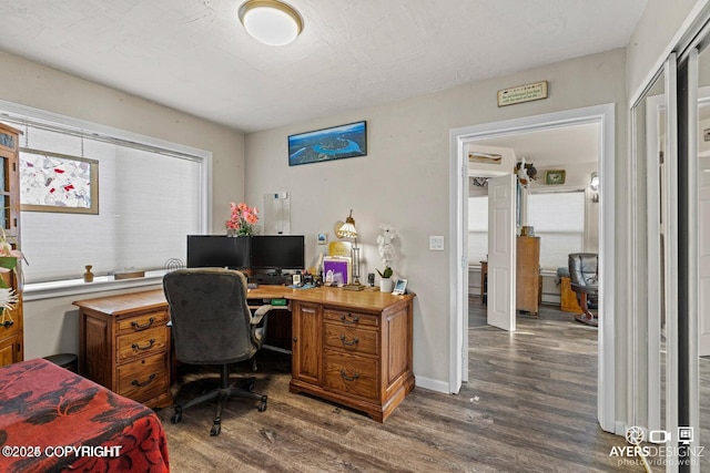 office space featuring wood finished floors and baseboards