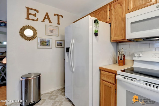 kitchen featuring white appliances, baseboards, light countertops, backsplash, and brown cabinetry