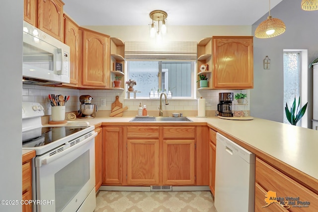 kitchen featuring open shelves, white appliances, a sink, and visible vents