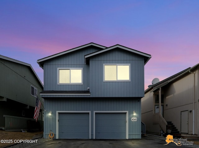 view of front of home with a garage and driveway