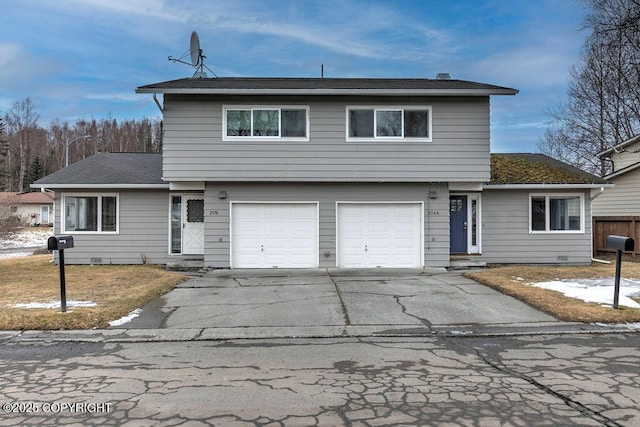 view of front of house featuring driveway and an attached garage