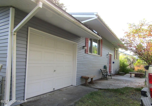 view of side of property with a garage