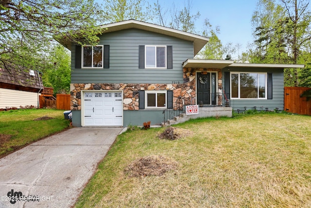 7210 Akutan Cir, Anchorage, AK 99504 - split level home with driveway, a garage, and stone siding