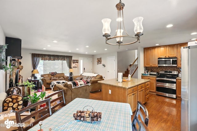 7210 Akutan Cir, Anchorage, AK 99504 - dining room with dark wood-type flooring, recessed lighting, and a chandelier