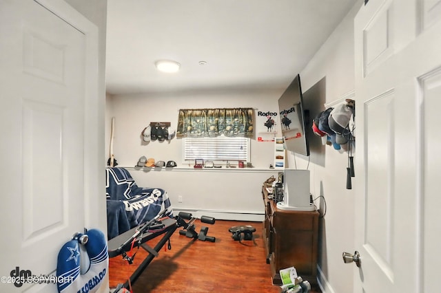 7210 Akutan Cir, Anchorage, AK 99504 - workout room with a baseboard radiator and wood finished floors