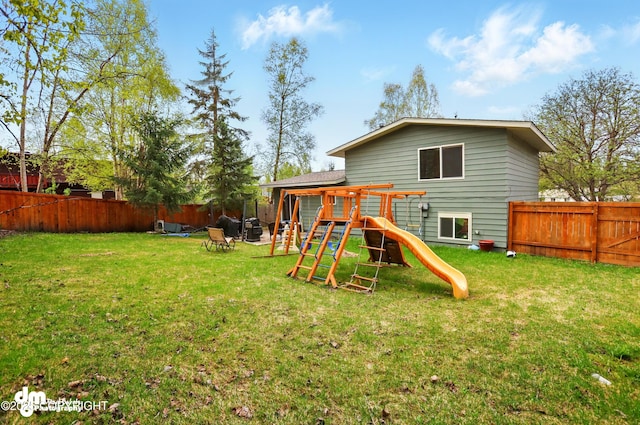 7210 Akutan Cir, Anchorage, AK 99504 - rear view of house featuring a playground