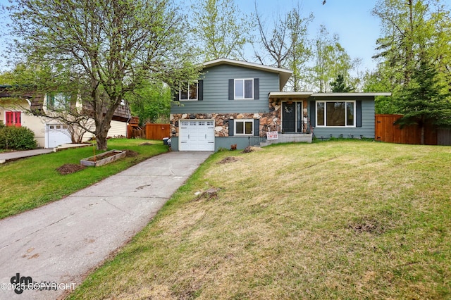 7210 Akutan Cir, Anchorage, AK 99504 - split level home with stone siding, driveway, and an attached garage
