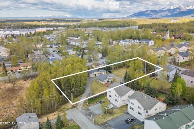 221 Creekside St, Anchorage, AK 99504 - aerial perspective of suburban area with property parcel outlined and mountains