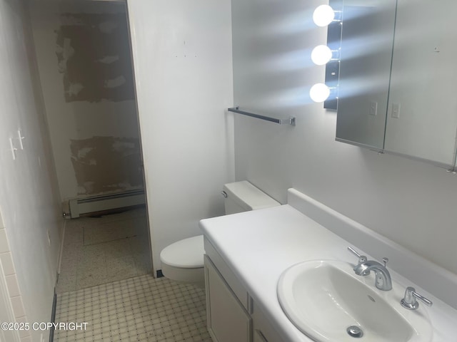 bathroom featuring a baseboard radiator, tile patterned flooring, toilet, vanity, and a shower stall