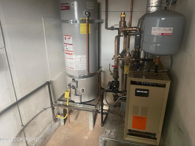 utility room with strapped water heater