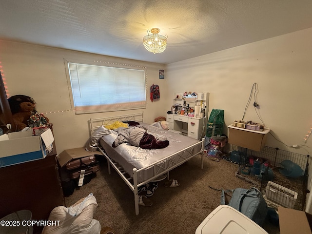 bedroom featuring a chandelier, carpet, and a textured ceiling