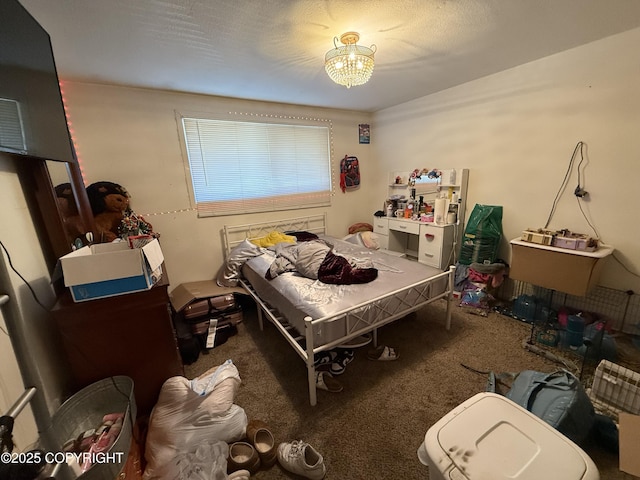 bedroom with carpet floors and a notable chandelier