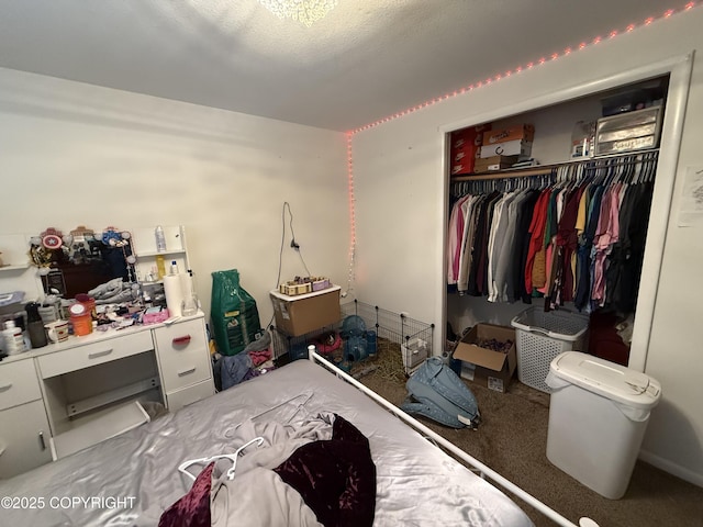 bedroom featuring a textured ceiling, a closet, and carpet flooring