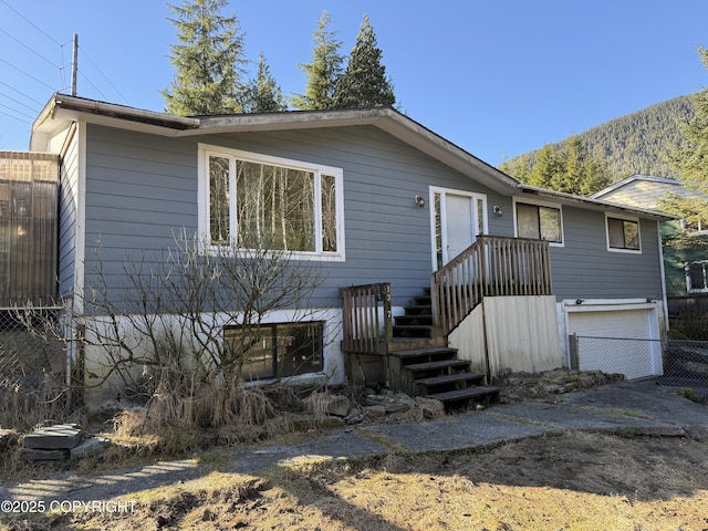 view of front of house with fence