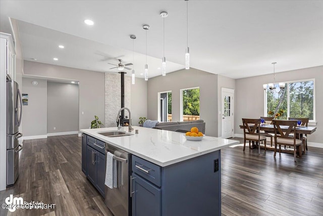 kitchen with stainless steel appliances, dark wood-type flooring, plenty of natural light, and a sink