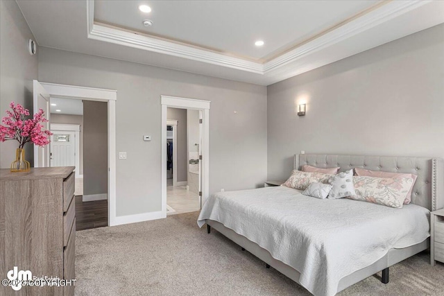 bedroom with recessed lighting, carpet, a raised ceiling, and baseboards