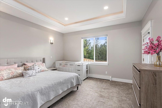 bedroom featuring baseboards, a tray ceiling, carpet flooring, and ornamental molding