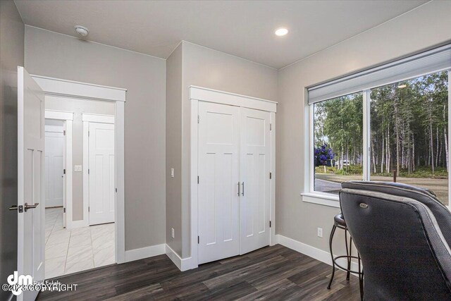 office featuring recessed lighting, wood finished floors, and baseboards