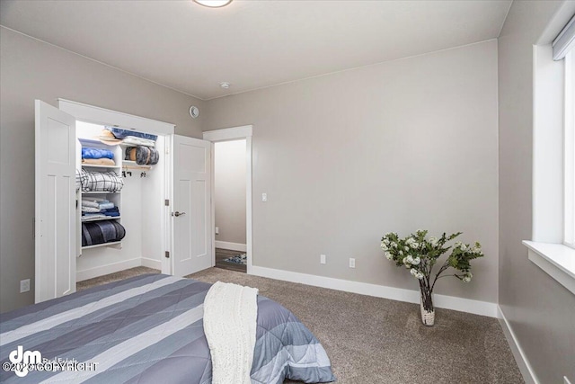 bedroom featuring carpet flooring and baseboards