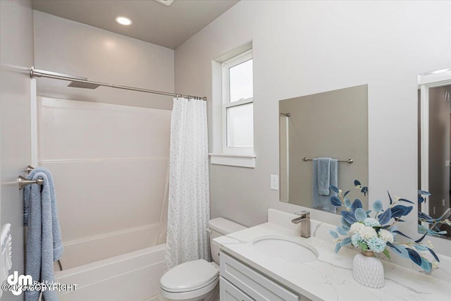 bathroom featuring toilet, shower / bath combo, and vanity